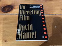 Front cover of paperback showing title, author and minor scuff