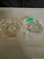 Pair of round crystal candle holders on table