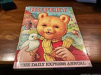 Front cover showing title Rupert, bear illustration, Daily Express Annual banner