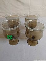 Four smokey brown stemmed goblets