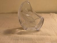 Full view of clear glass paperweight showing kingfisher design