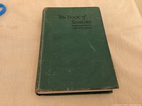 Front cover of green cloth hardcover book