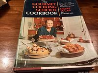 Front cover of The Gourmet Cooking School Cookbook with dust jacket