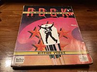 Front cover of the softcover book showing title, author and artwork