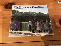Front cover of The Mennonite Canadians showing title, author and wear