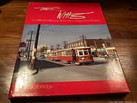 Front cover of The Witts hardcover book showing title, subtitle, author and streetcar image