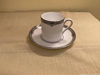 Cup on saucer showing Amherst border detailing