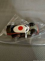 Side view of Hot Wheels Katana car in plastic bag