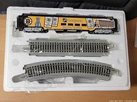 Diesel locomotive and two track sections in styrofoam insert