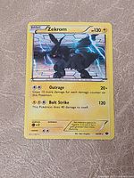 Front of Zekrom holo card showing artwork, attacks and set number