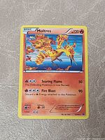 Front view of Moltres holo card