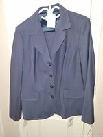 front view of blue blazer with tags attached