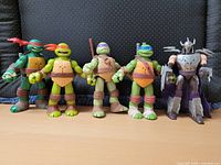 Front view of all five figures standing