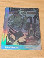 Front of hologram card showing Belfour image and Vezina Trophy