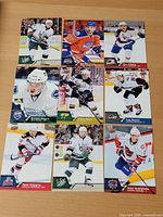 Nine Upper Deck AHL cards laid out showing fronts and player images