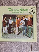 Front cover showing title, band image, 2 records sticker