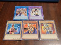 Front view of five Yu-Gi-Oh cards