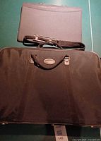 Both portfolio bags; larger Jacksons bag below, smaller unbranded bag above
