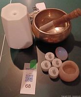 All items overview: diffuser, singing bowl with striker, quartz tealight holder, healing stone, four LED tealights, power adapter