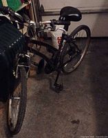 full view of black mountain bike in garage