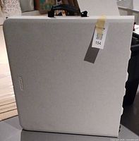 Table folded with handle visible