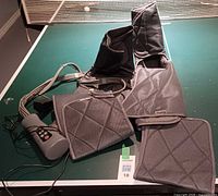 Complete Renpho air compression massager system with wraps, controller, hoses and power adapter displayed on table.