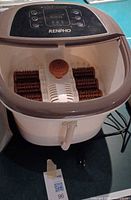 Overall view of Renpho foot spa showing basin, rollers, handle, cord