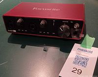 Front view showing combo inputs, gain knobs, monitor knob, headphone jack