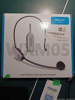 Front of retail box showing Bietrun WXM05 wireless headset mic and receiver