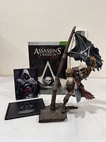 Overall set showing statue, game case, steelbook and art book