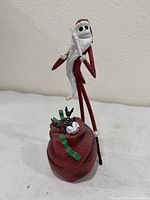 Front view of Jack Skellington Santa figurine with toy sack