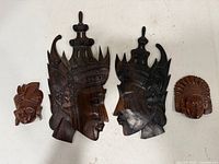 Front view of all four wooden wall masks