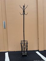 full view of wrought iron coat rack showing height and hooks