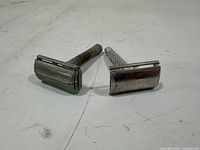 Both razors front view, showing heads and handles