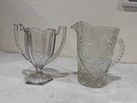 Sugar bowl and pitcher side by side