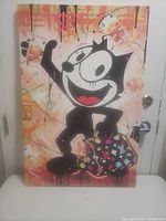Front view of canvas art showing full Felix the Cat design