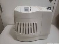 Front-side view of humidifier showing overall form and cord