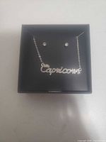 Necklace and earrings displayed in open box