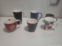 Front view of all six mugs arranged together