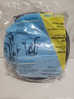 Front view of sealed Bur-Cam drainage kit showing label with model number and specifications
