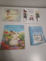 Group shot of all four hardcover children’s books