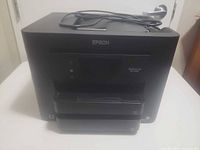 Front and top of Epson WF-4730 with power cord