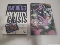 Two graphic novels side by side, covers visible