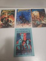 All four comic books laid out
