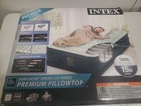 Front of retail box showing product image, brand, model, size, height, pump feature