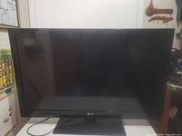 Front view of LG flat screen TV on stand