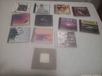 Group shot of all 13 CDs laid out