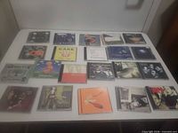 Full layout of nineteen CD jewel cases on table