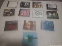 Overview of all 13 CDs laid out on table