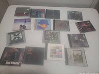 Overview of all 15 CDs laid out on table